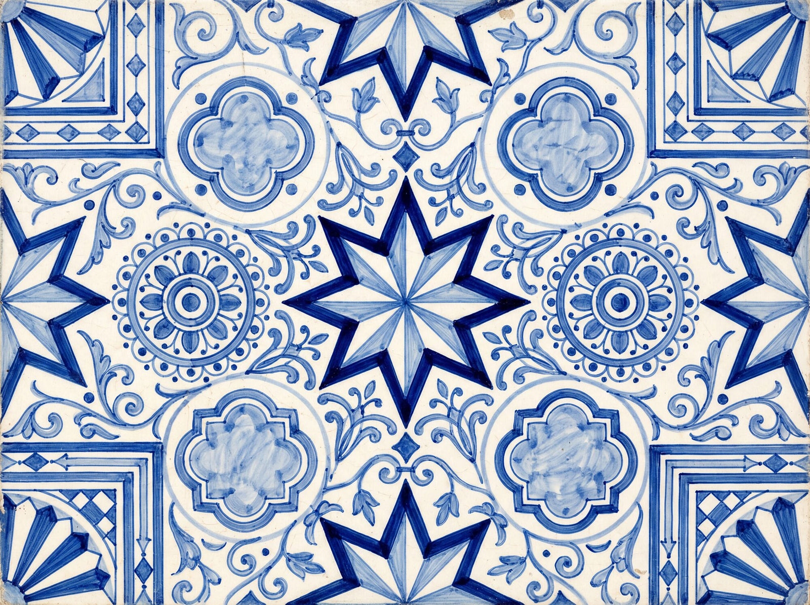 Mediterranean tile mural wallpaper with hand-painted eight-pointed stars, mandala rosettes, quatrefoil medallions and arabesque scrolls in multi-toned cobalt and navy on a luminous porcelain white ground