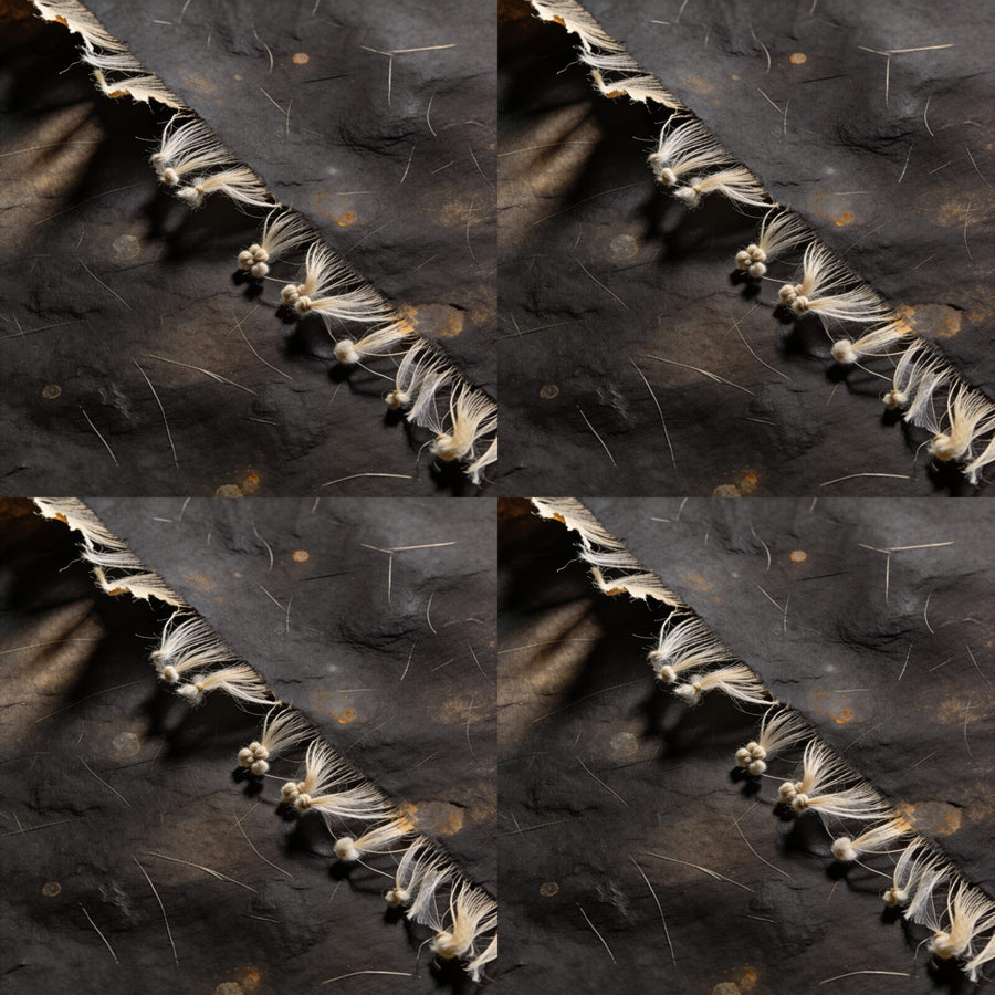 Immerse your space in the quiet authority of our Dark Paper Texture mural. Deep brownish-black, warm accents. Made to order.