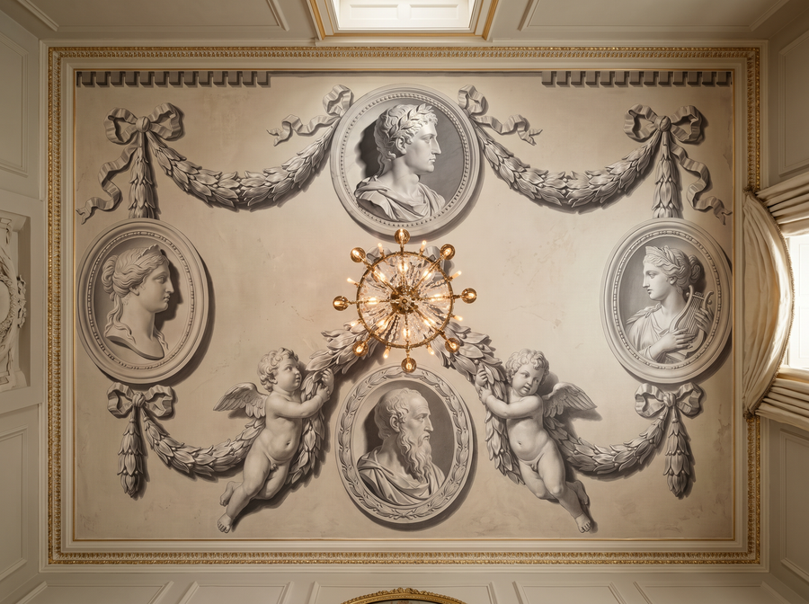 Grisaille Medallion scenic wallpaper mural on the feature wall of an English-country dining room_fc86338c df54 4e68 99be 27258e935a38, in a warm neutral palette — The Wall Shawl.