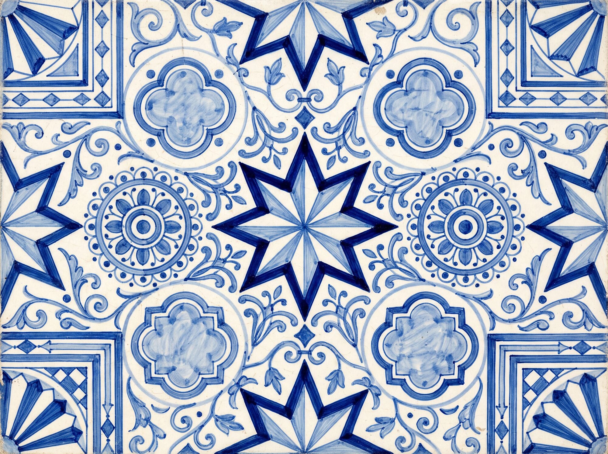 Mediterranean tile mural wallpaper with hand-painted eight-pointed stars, mandala rosettes, quatrefoil medallions and arabesque scrolls in multi-toned cobalt and navy on a luminous porcelain white ground