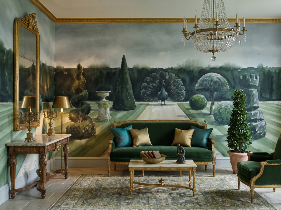Topiary Garden scenic wallpaper mural on the feature wall of an English-country entrance hall, in a moody black-and-charcoal palette — The Wall Shawl.