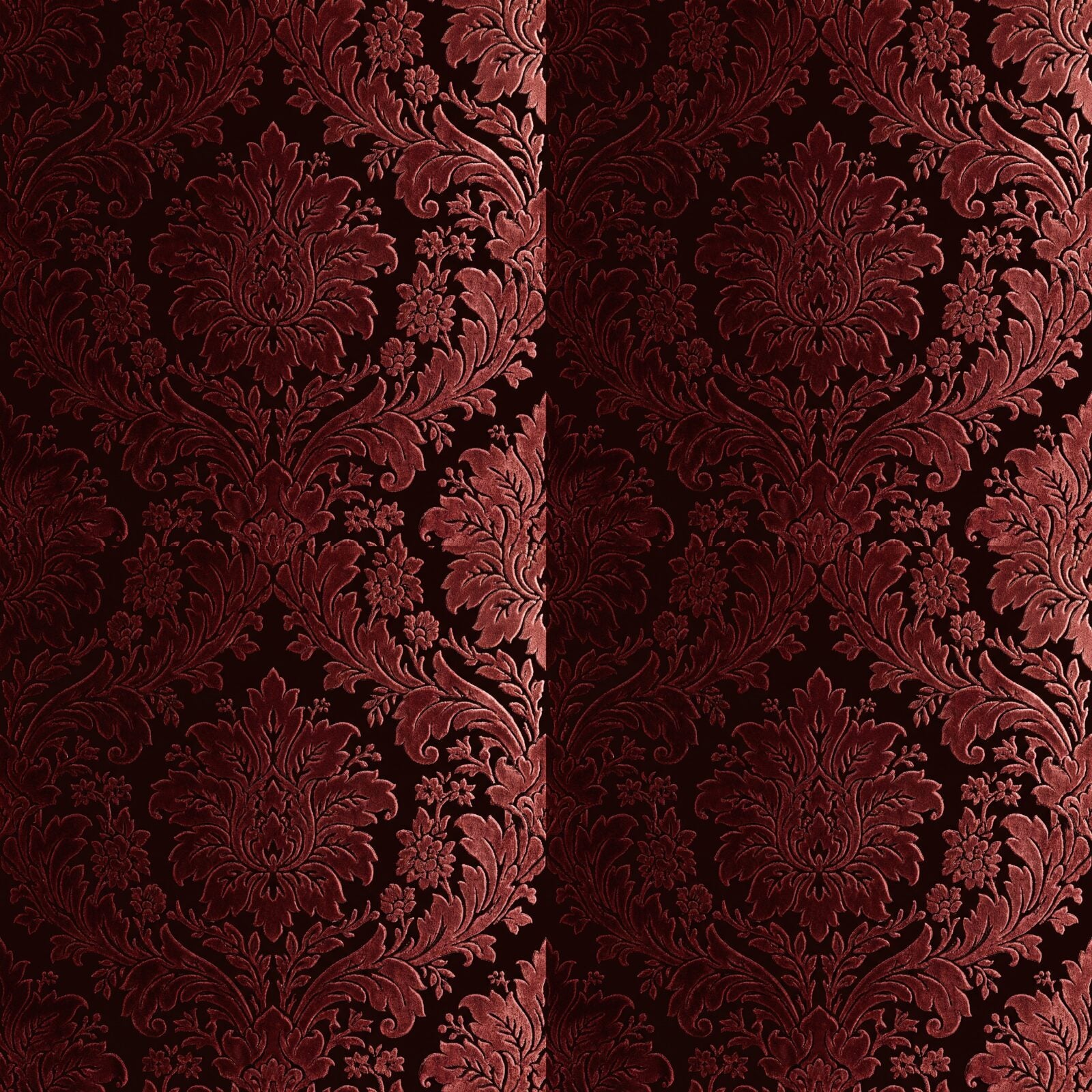 Experience the opulent tactility of Victorian Flocked Damask in Oxblood and deep reds. Made to order.